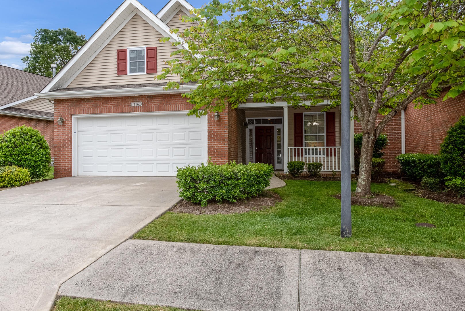 116 Devanshire Court Oak Ridge, TN 37830 - Photo 2 of 30 a front view of a house with a yard and a garage