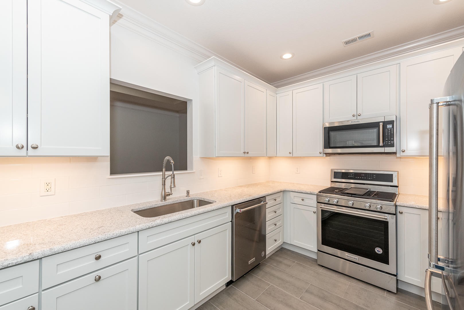 116 Devanshire Court Oak Ridge, TN 37830 - Photo 5 of 30 a kitchen with sink a microwave and cabinets