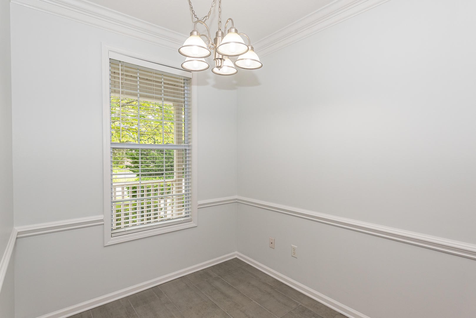 116 Devanshire Court Oak Ridge, TN 37830 - Photo 9 of 30 en empty room with windows and chandelier
