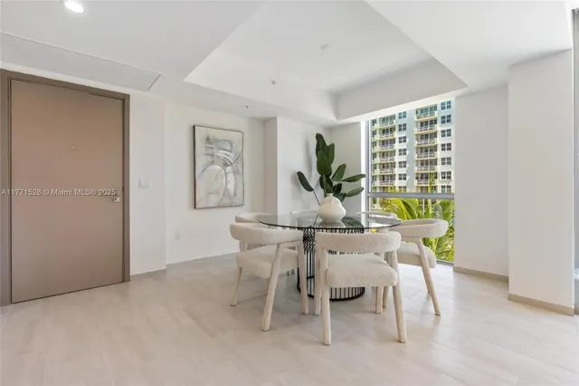 a kitchen with stainless steel appliances a refrigerator and a sink