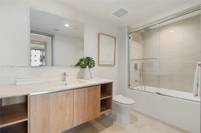 a view of a patio with table and chairs and potted plants
