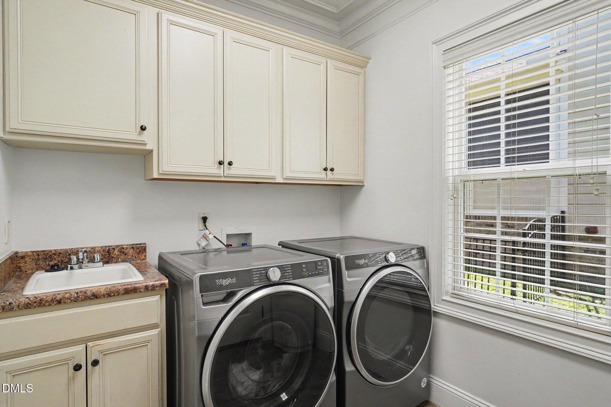 1729 Frenchwood Drive Raleigh, NC 27612 - Photo 34 of 46 a utility room with dryer and washer