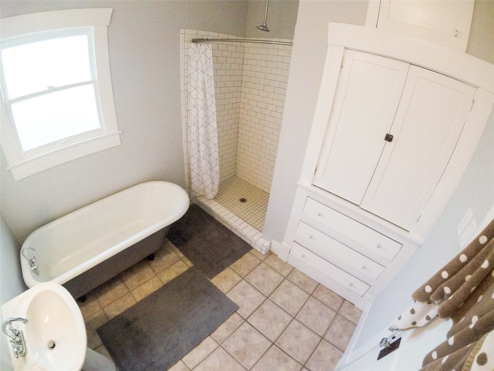 210 Tabor Street Houston, TX 77009 - Photo 20 of 20 a bathroom with a sink toilet and shower