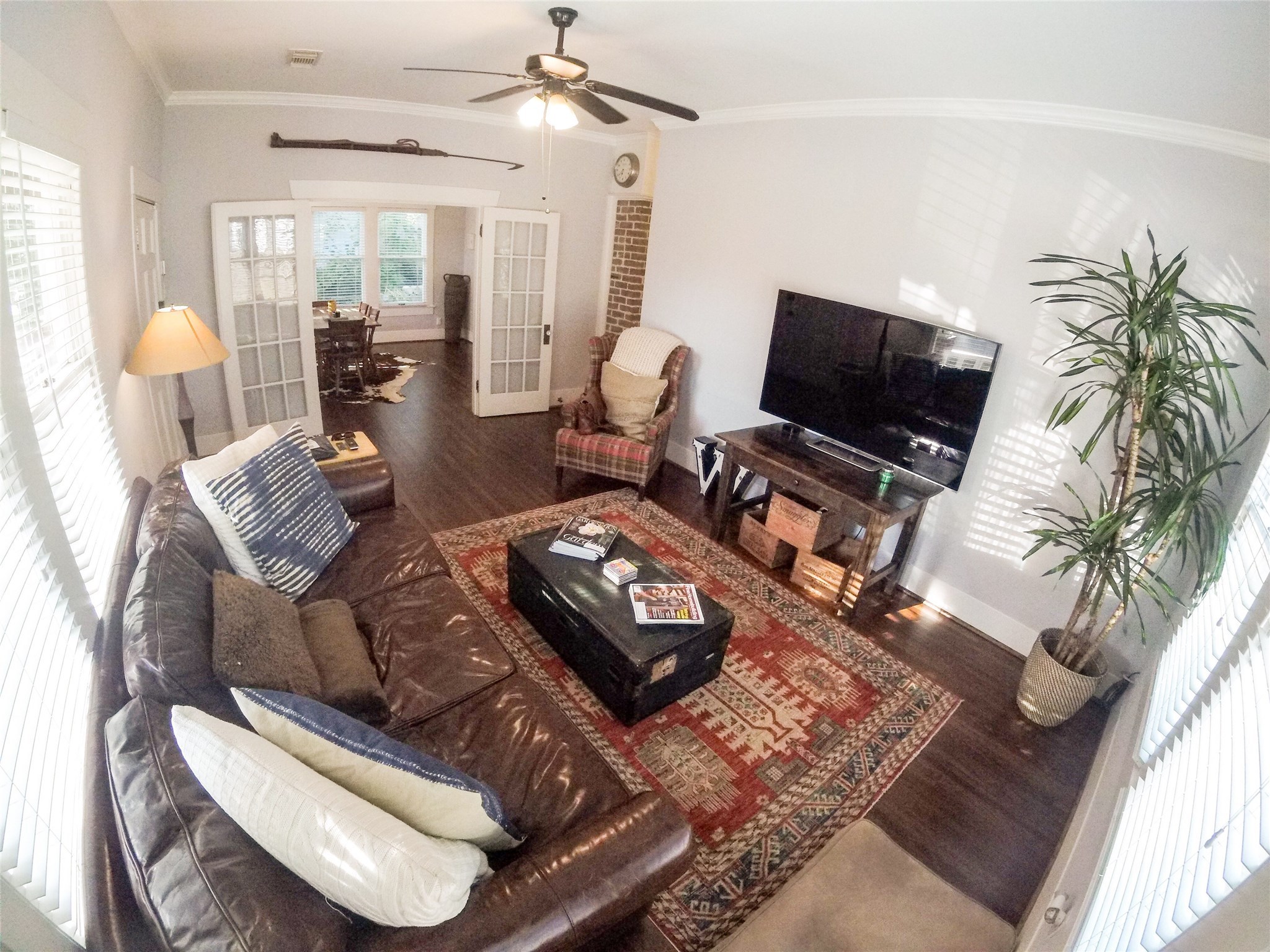 210 Tabor Street Houston, TX 77009 - Photo 5 of 20 a living room with furniture and a flat screen tv