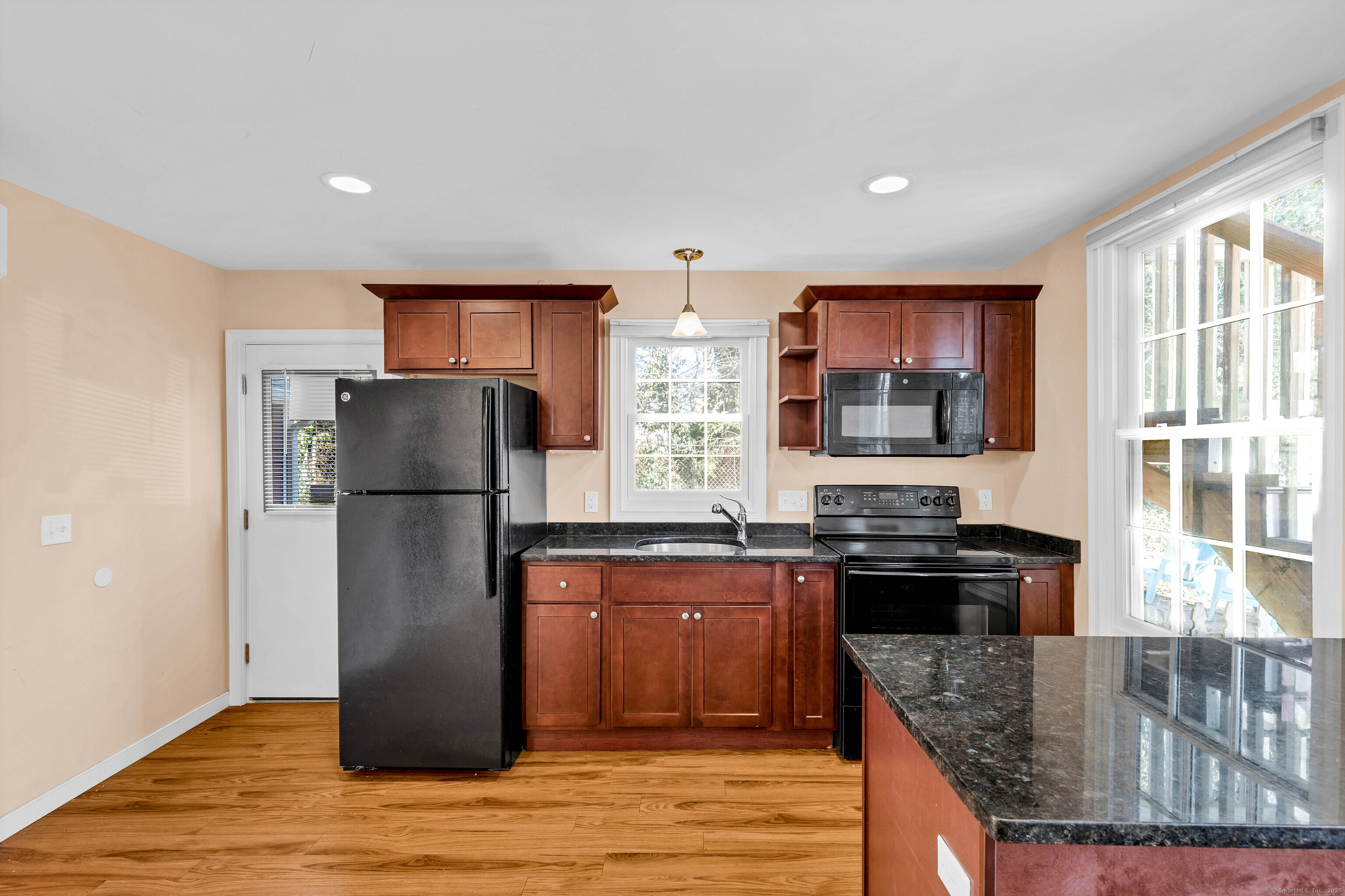 9 Brewer Street New London, CT 06320 - Photo 23 of 40 a kitchen with stainless steel appliances granite countertop a refrigerator a stove top oven a sink and dishwasher