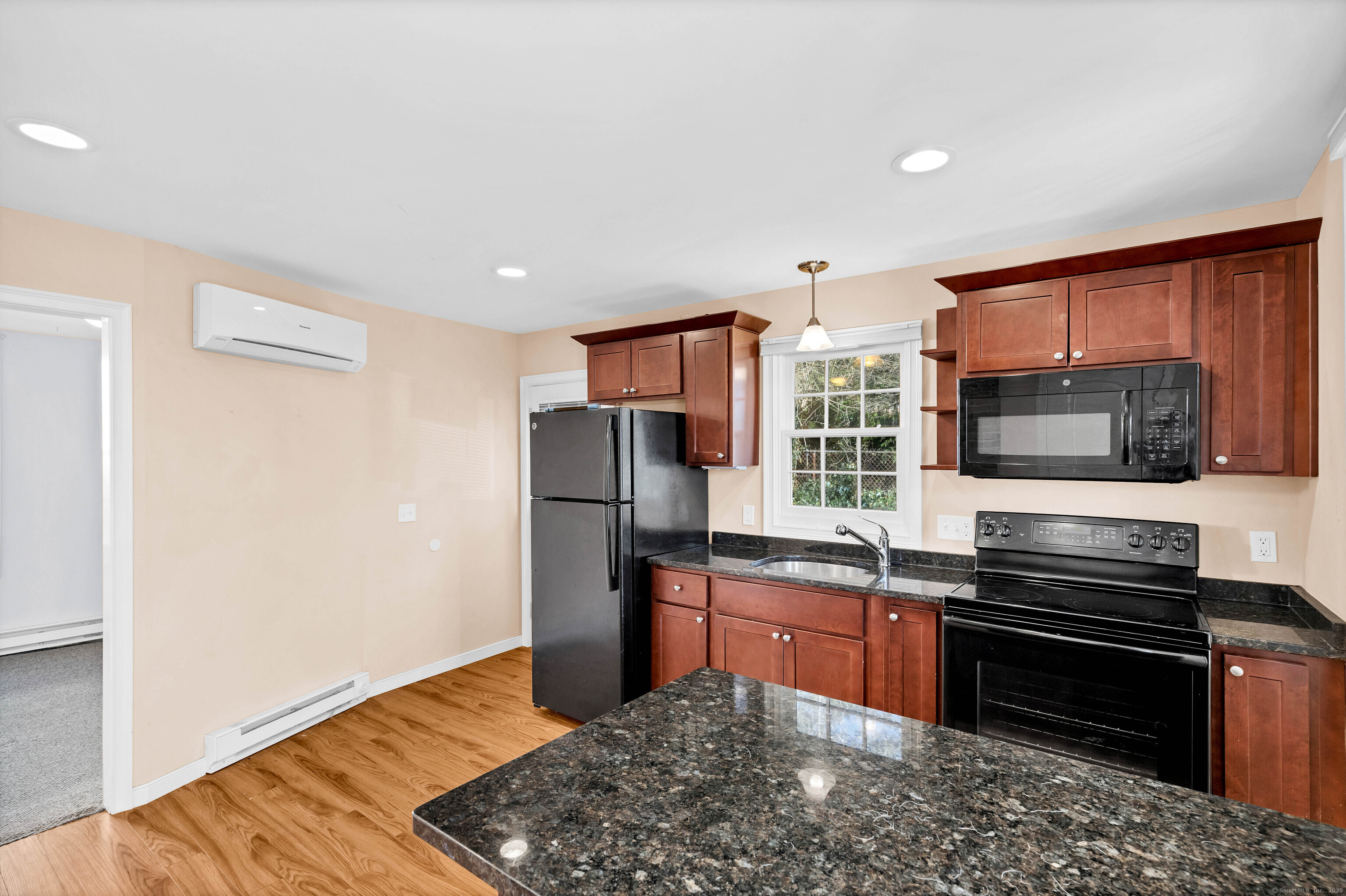 9 Brewer Street New London, CT 06320 - Photo 25 of 40 a kitchen with stainless steel appliances a stove sink and microwave