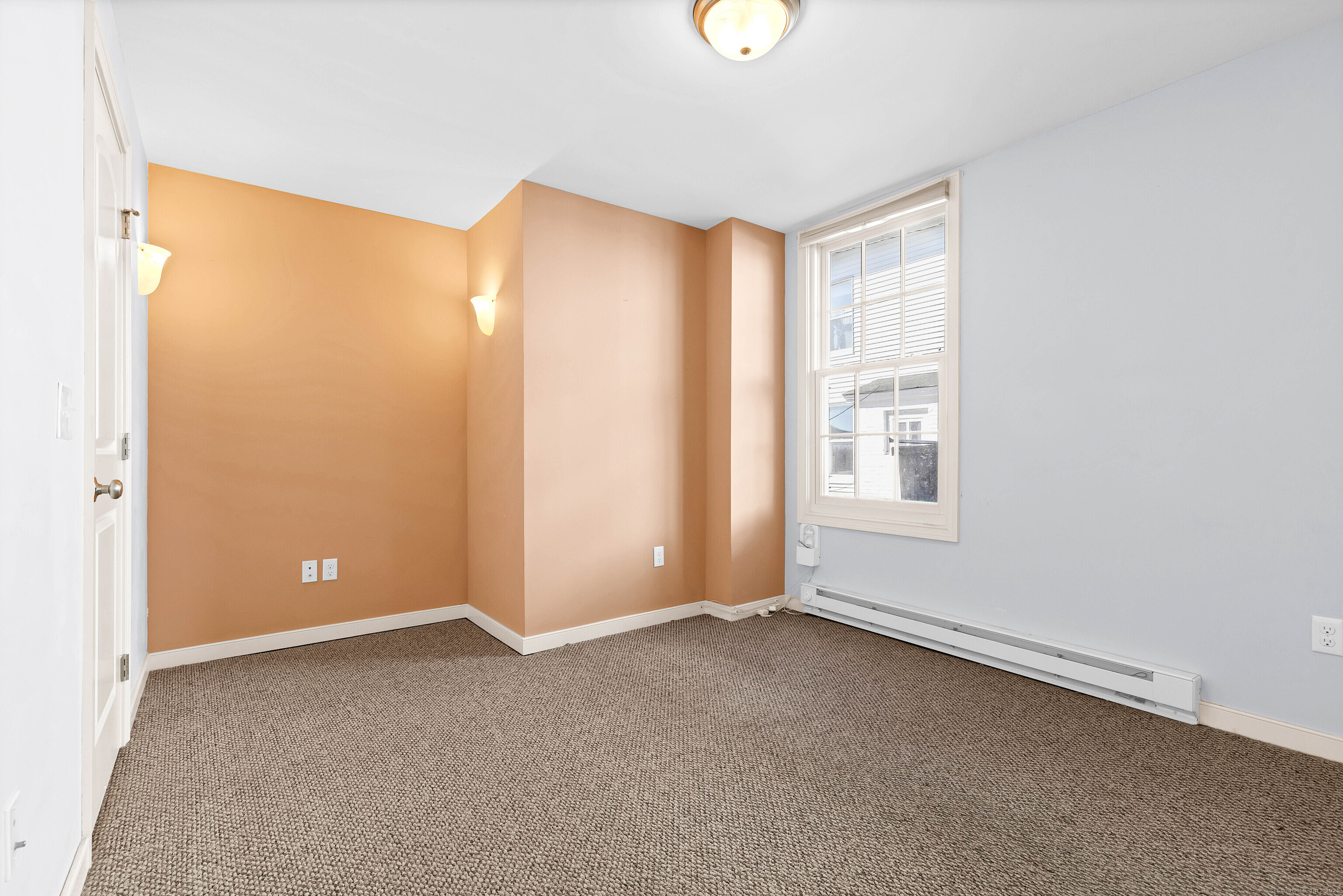 9 Brewer Street New London, CT 06320 - Photo 28 of 40 an empty room with windows and closet