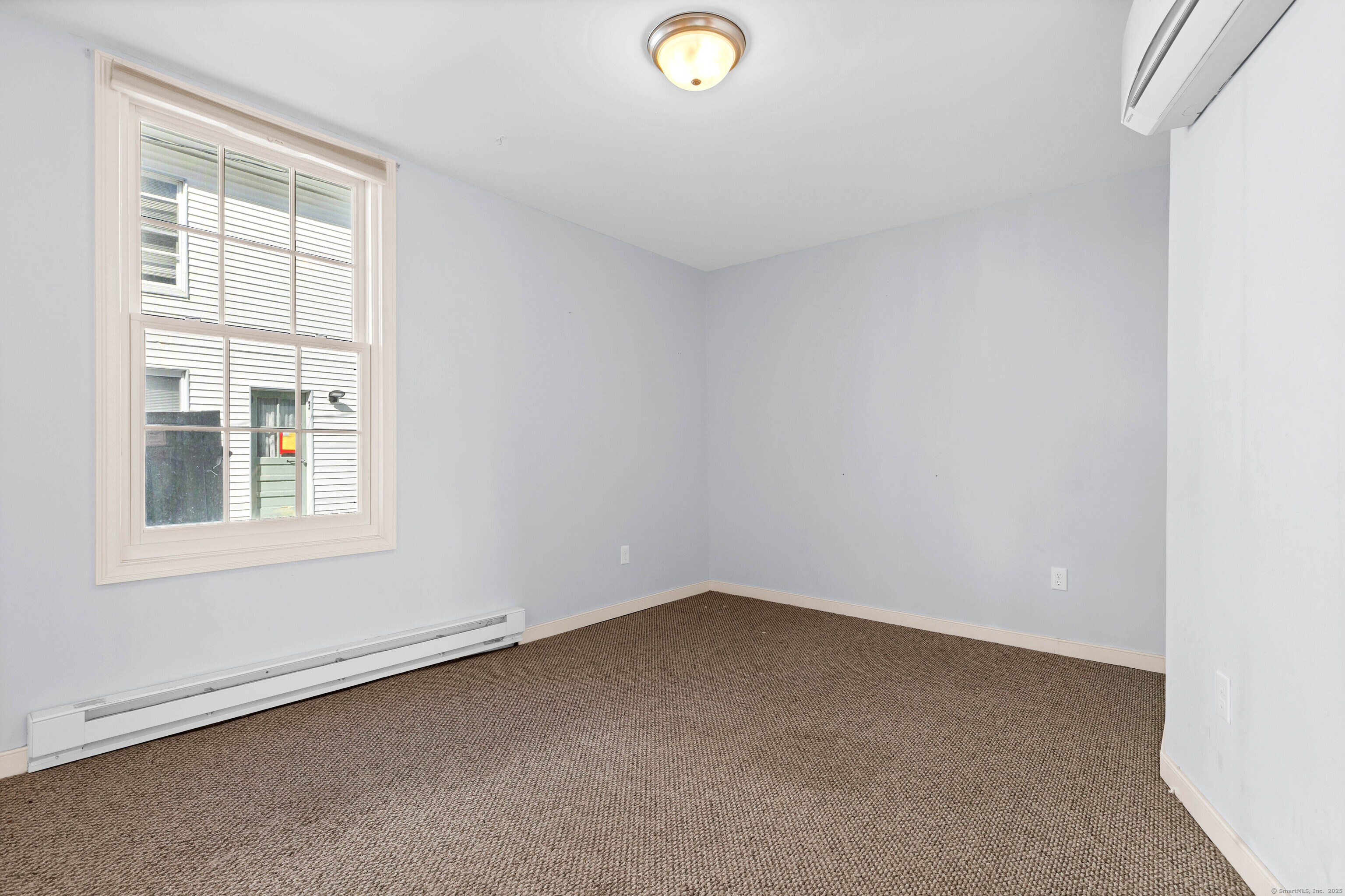 9 Brewer Street New London, CT 06320 - Photo 29 of 40 an empty room with a window