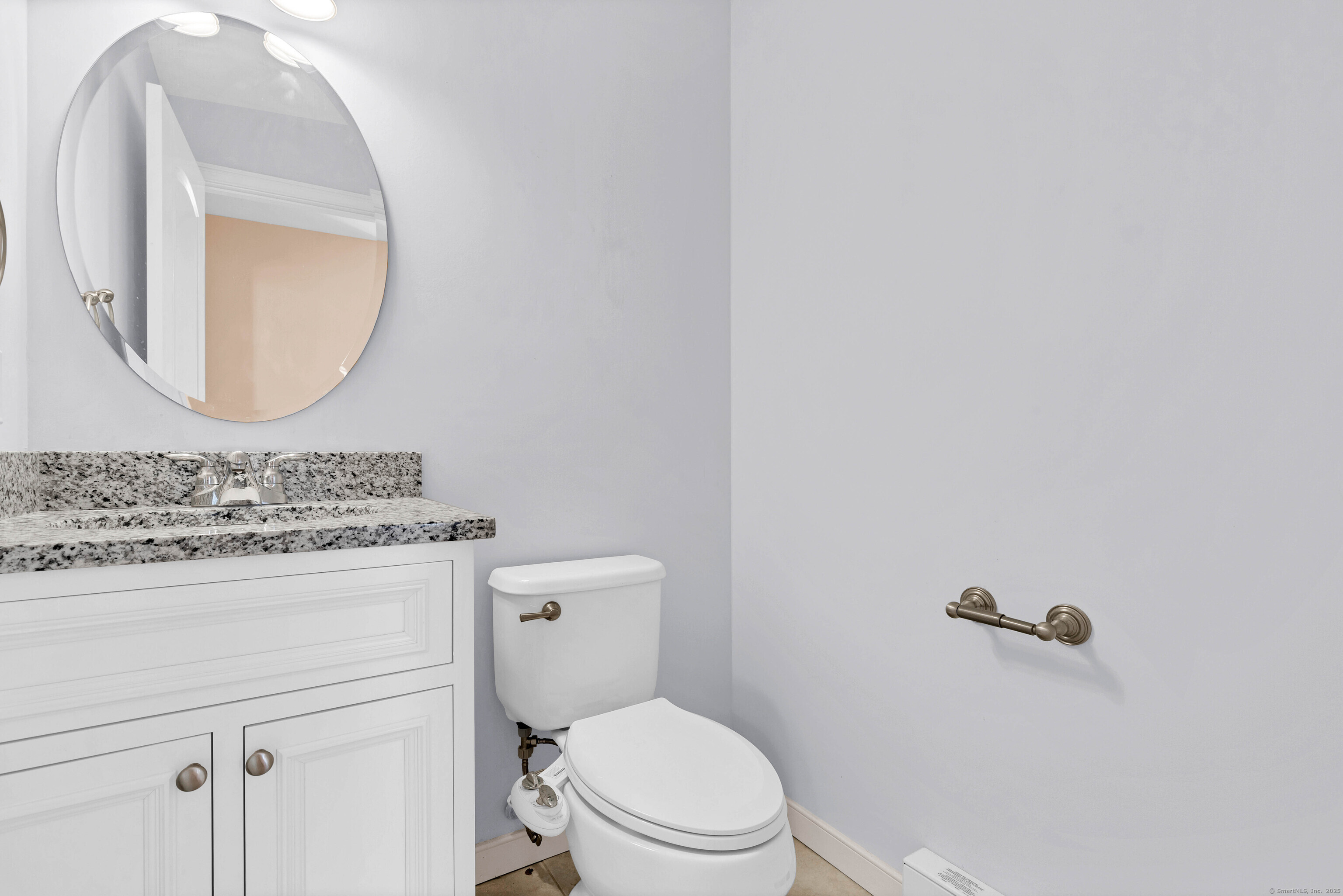 9 Brewer Street New London, CT 06320 - Photo 32 of 40 a bathroom with a granite countertop toilet sink mirror and vanity