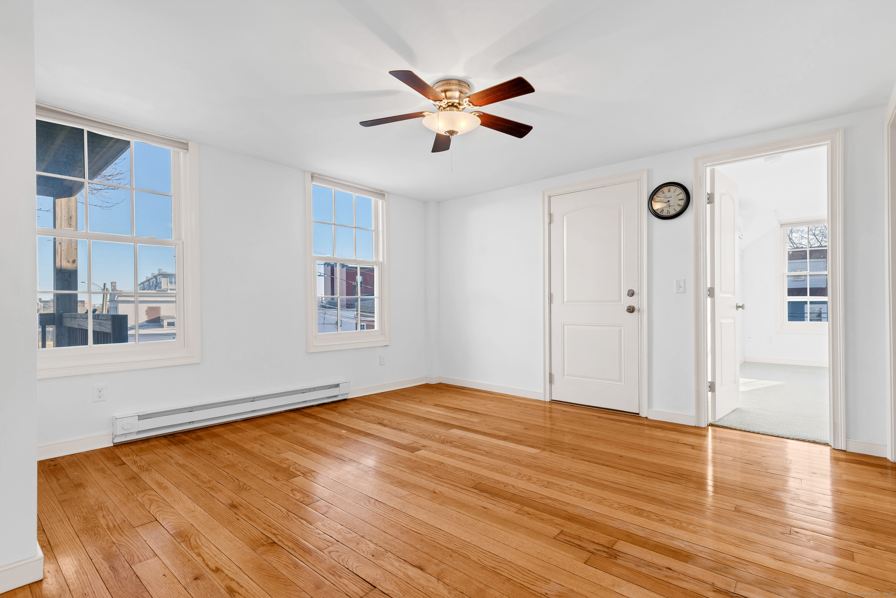 9 Brewer Street New London, CT 06320 - Photo 33 of 40 a view of an empty room with wooden floor