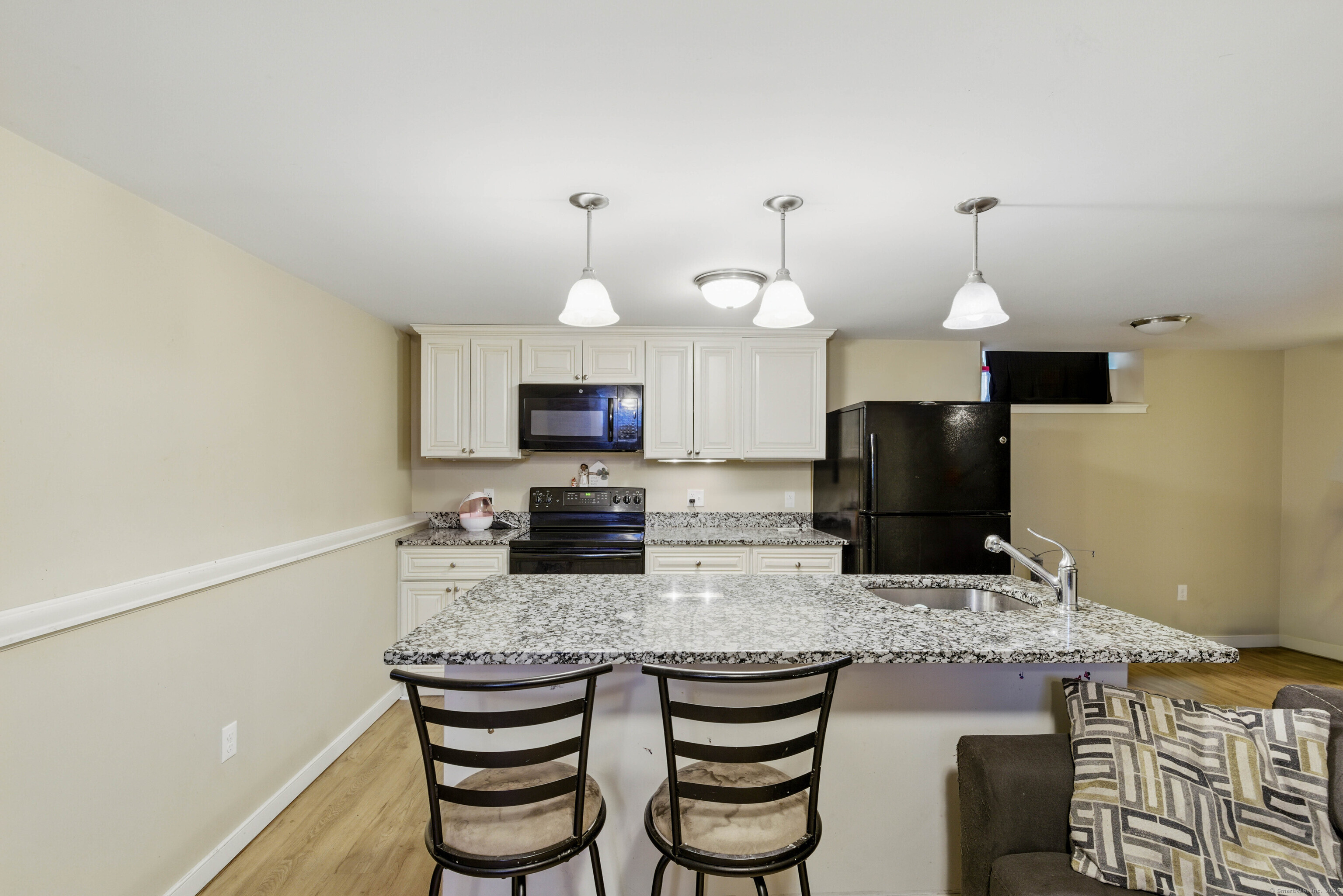 9 Brewer Street New London, CT 06320 - Photo 37 of 40 a kitchen with granite countertop a stove and a sink