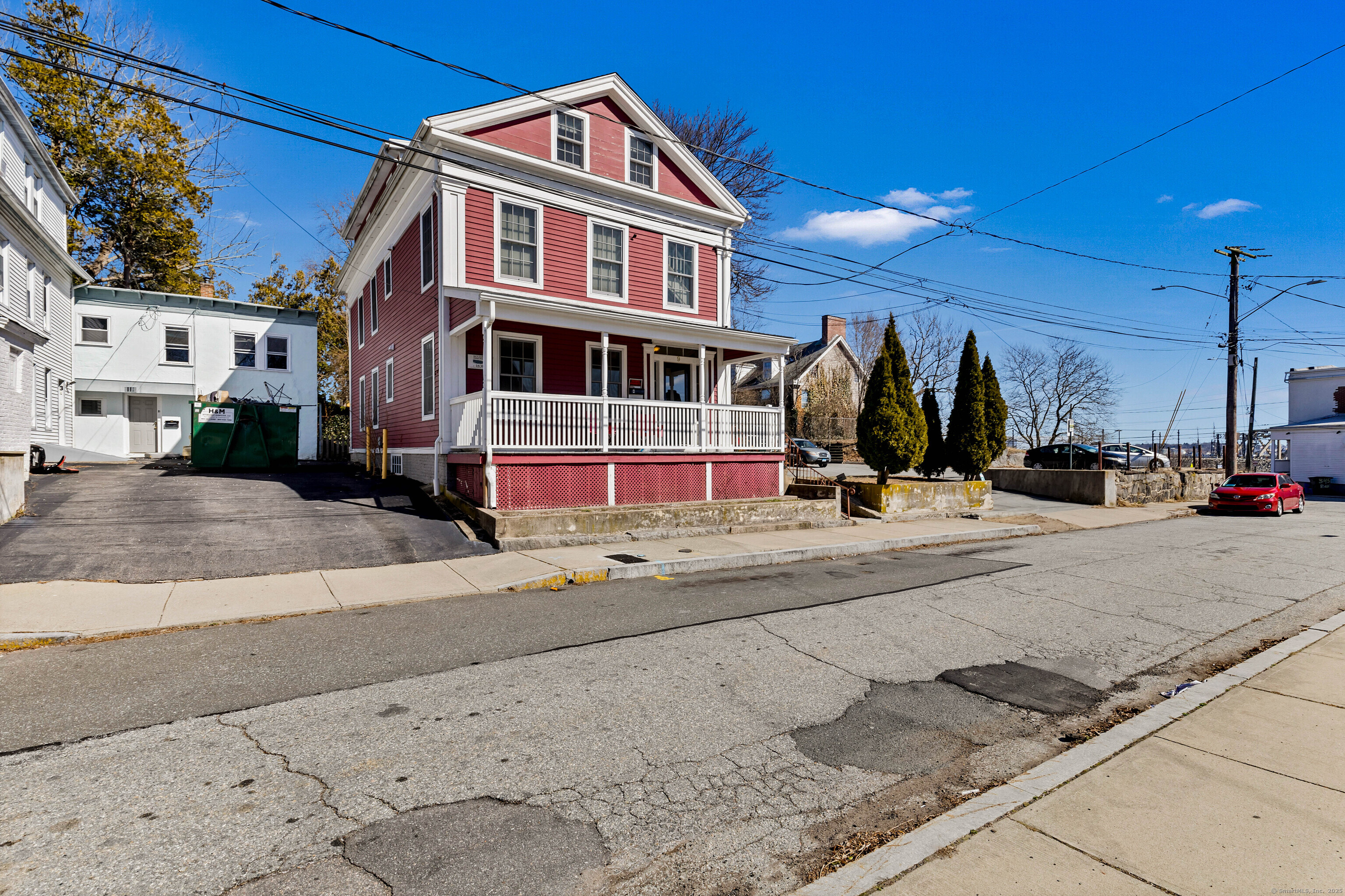 9 Brewer Street New London, CT 06320 - Photo 6 of 40 a view of a street with a building in the background