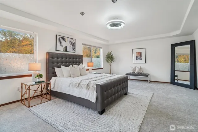 a bedroom with a bed and a couch