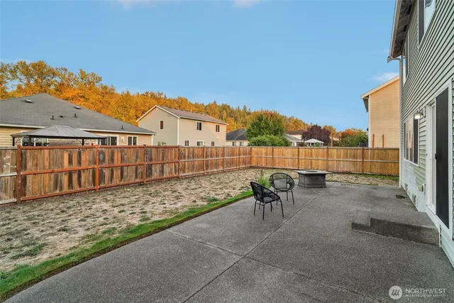 a view of a chair and table on the patio