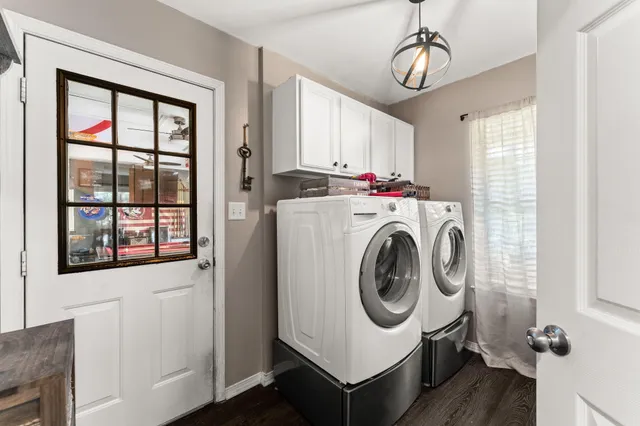 a workspace with wooden floor and a window