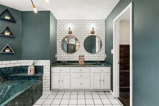 a view of a deck with two chair and wooden floor
