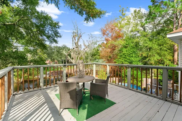 a view of outdoor seating with furniture and wooden floor