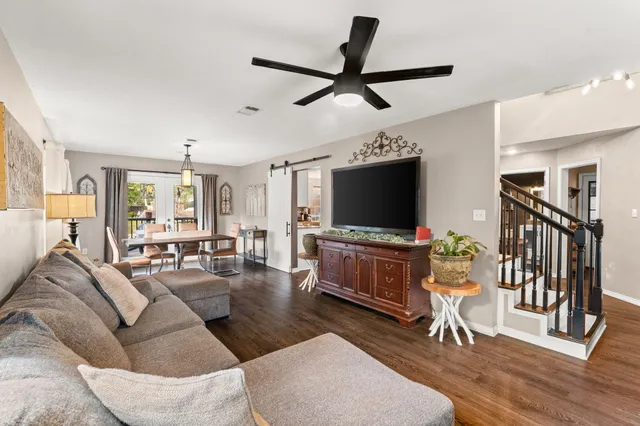 a living room with furniture and a flat screen tv