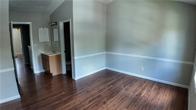 wooden floor in an empty room and a window