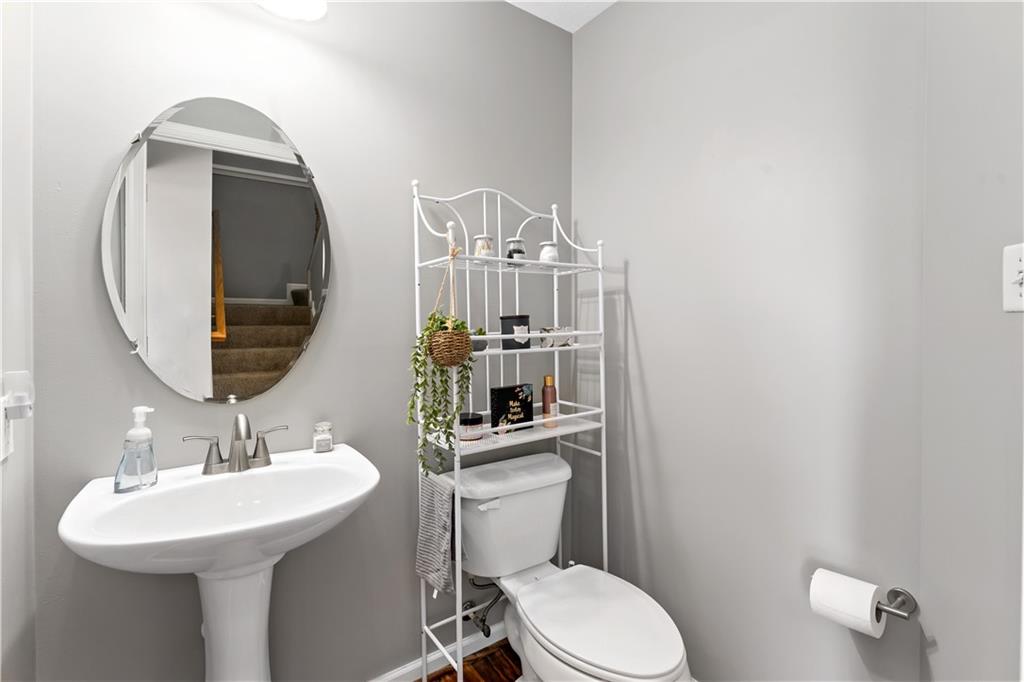 2000 Michael Drive Pittsburgh, PA 15227 - Photo 15 of 45 a bathroom with a sink a mirror a toilet and a mirror