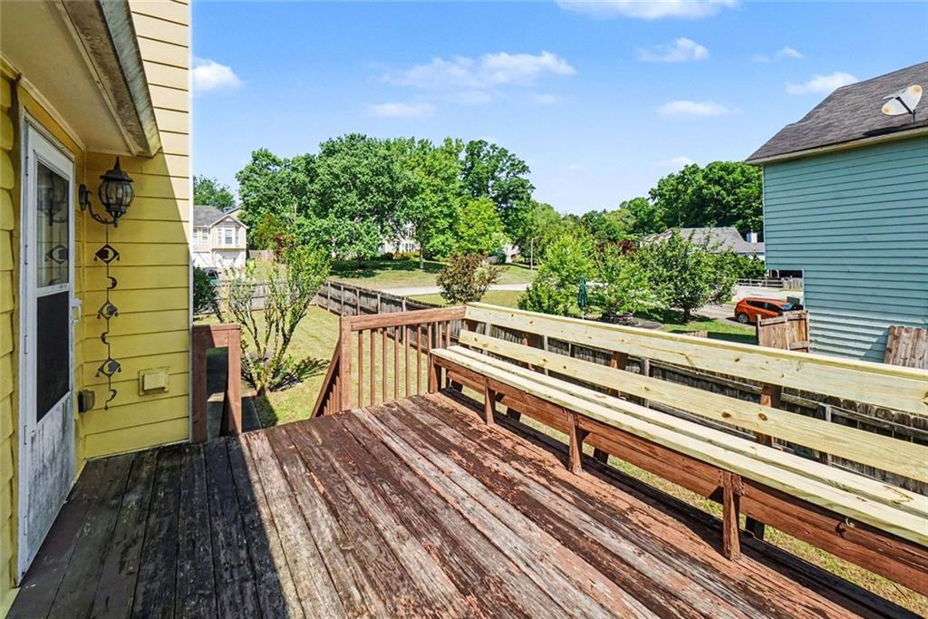 829 Dunes Way Austell, GA 30106 - Photo 25 of 28 a view of a balcony with wooden floor and potted plants