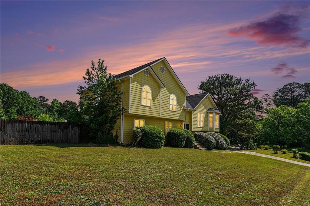 829 Dunes Way Austell, GA 30106 - Photo 3 of 28 a front view of a house with a yard