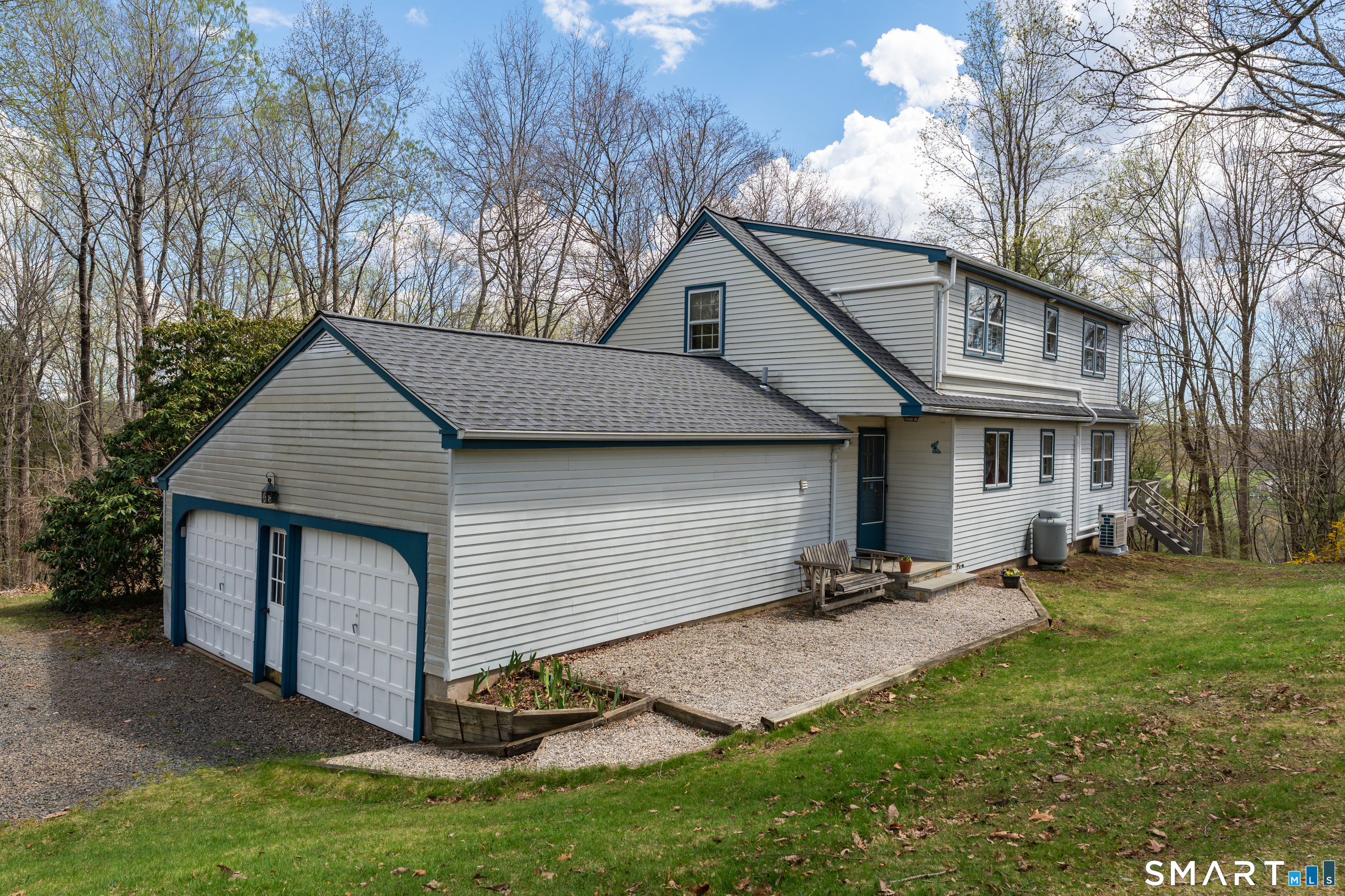 94 Quonnipaug Hill Road Guilford, CT 06437 - Photo 1 of 39 a front view of a house with a yard