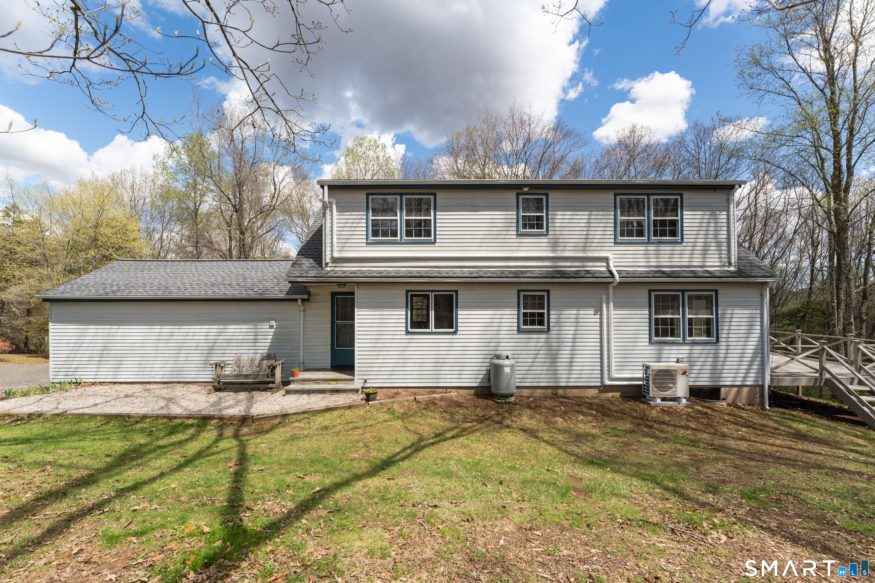 94 Quonnipaug Hill Road Guilford, CT 06437 - Photo 7 of 39 a front view of a house with a yard