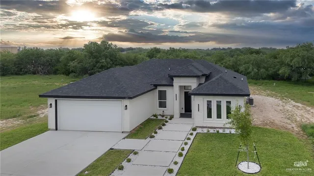 a aerial view of a house with a yard