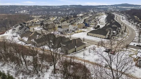 an aerial view of residential house with parking space