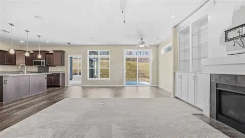 a large kitchen with a large window