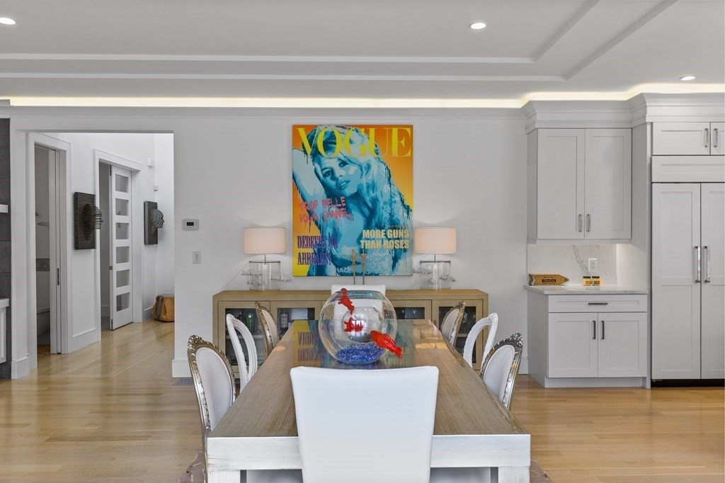 4 Dewing Path Wellesley, MA 02482 - Photo 11 of 41 a view of kitchen and dining room with furniture wooden floor and a rug