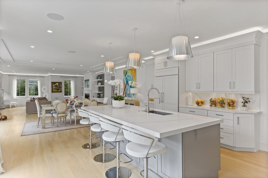 4 Dewing Path Wellesley, MA 02482 - Photo 13 of 41 a kitchen with a dining table and chairs