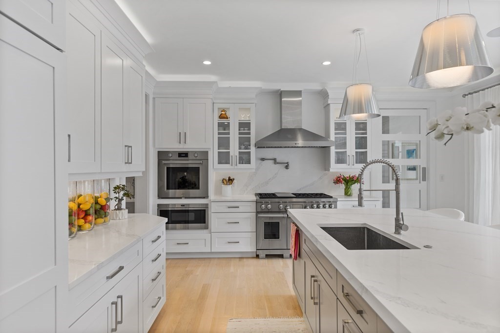 4 Dewing Path Wellesley, MA 02482 - Photo 15 of 41 a kitchen with stainless steel appliances granite countertop a stove a sink and a refrigerator