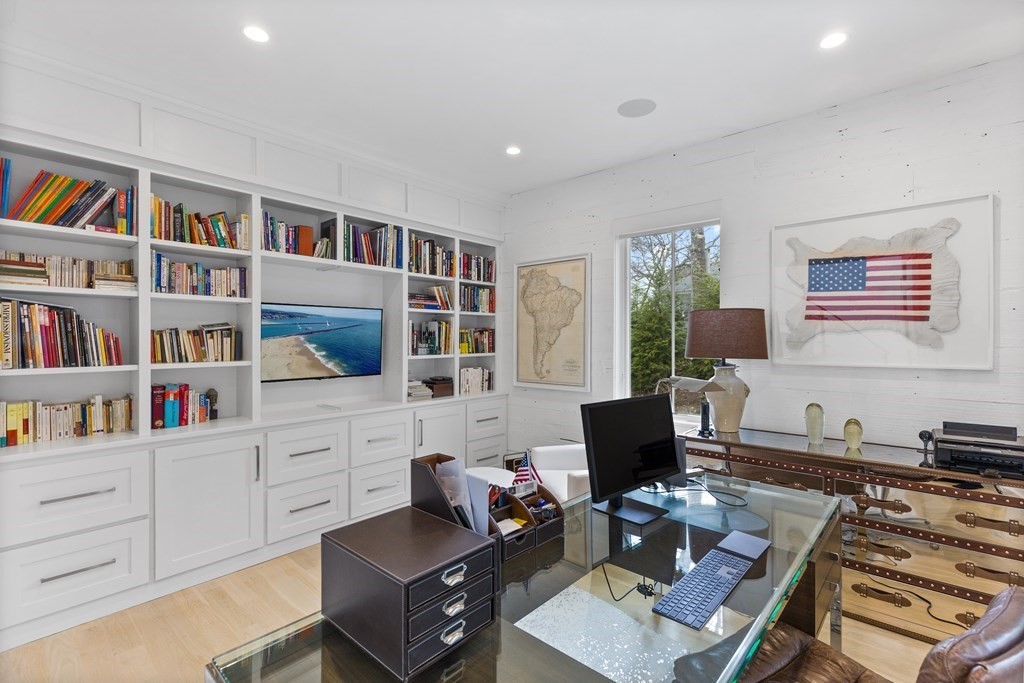 4 Dewing Path Wellesley, MA 02482 - Photo 17 of 41 a living room with furniture and a book shelf