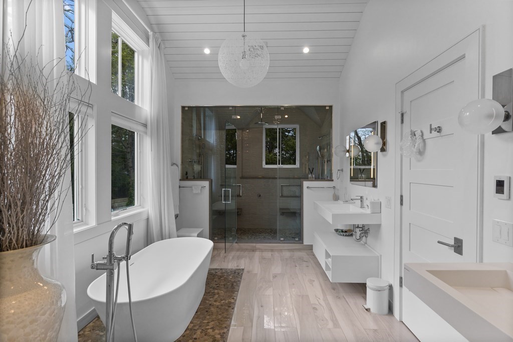 4 Dewing Path Wellesley, MA 02482 - Photo 25 of 41 a bathroom with a tub a sink and mirror