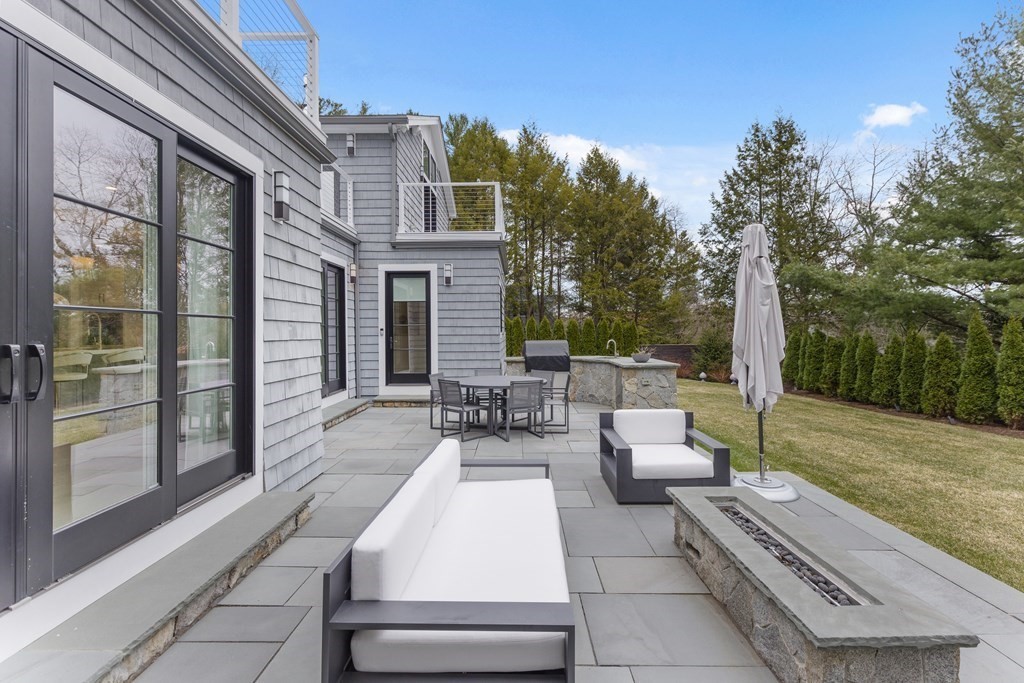 4 Dewing Path Wellesley, MA 02482 - Photo 41 of 41 a view of a patio with couches and potted plants