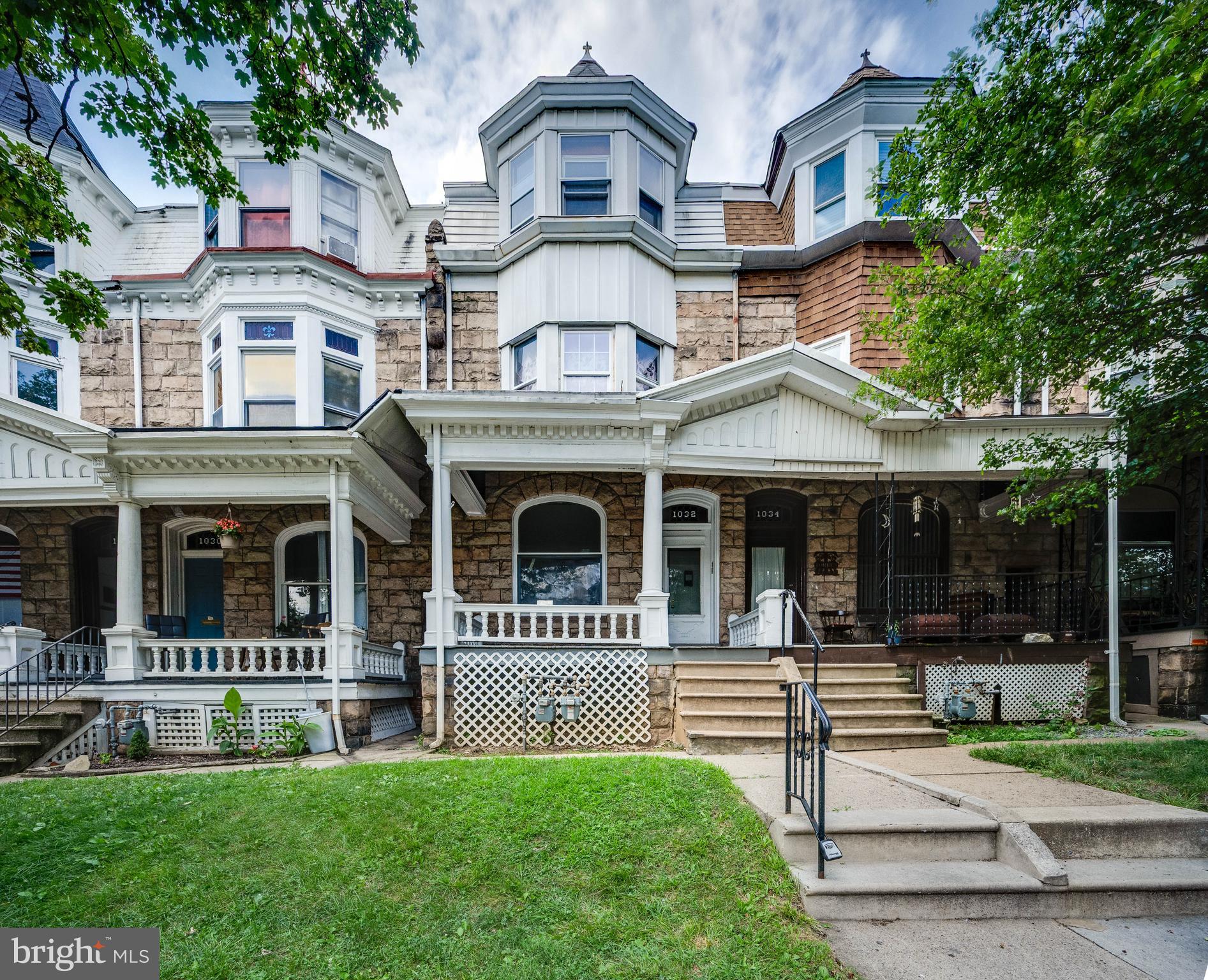 1032 North 5th Street Reading, PA 19601 - Photo 1 of 45 a front view of a house with a yard