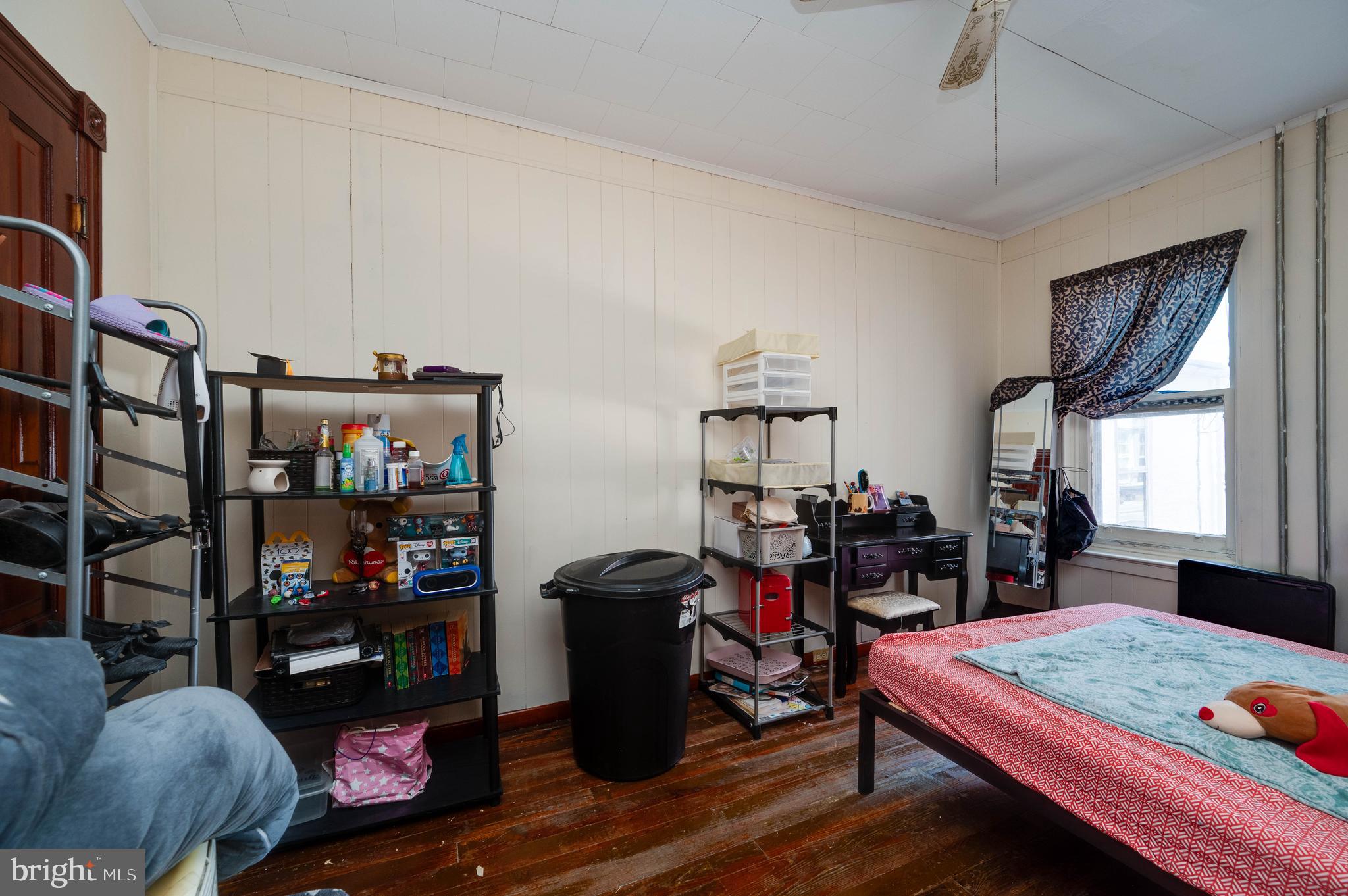 1032 North 5th Street Reading, PA 19601 - Photo 30 of 45 a room with furniture and a book shelf