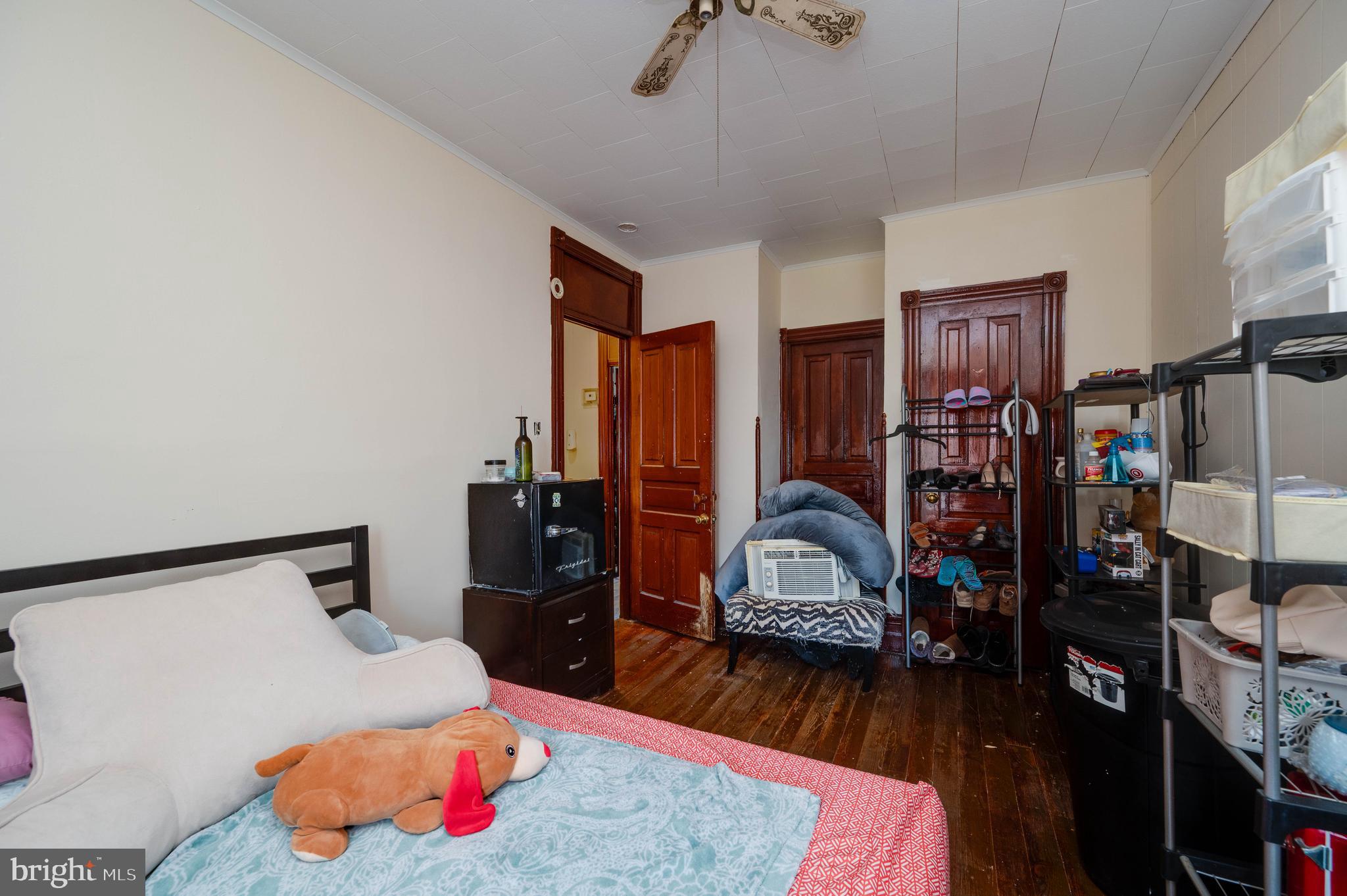 1032 North 5th Street Reading, PA 19601 - Photo 32 of 45 a bedroom with bed and wooden floor