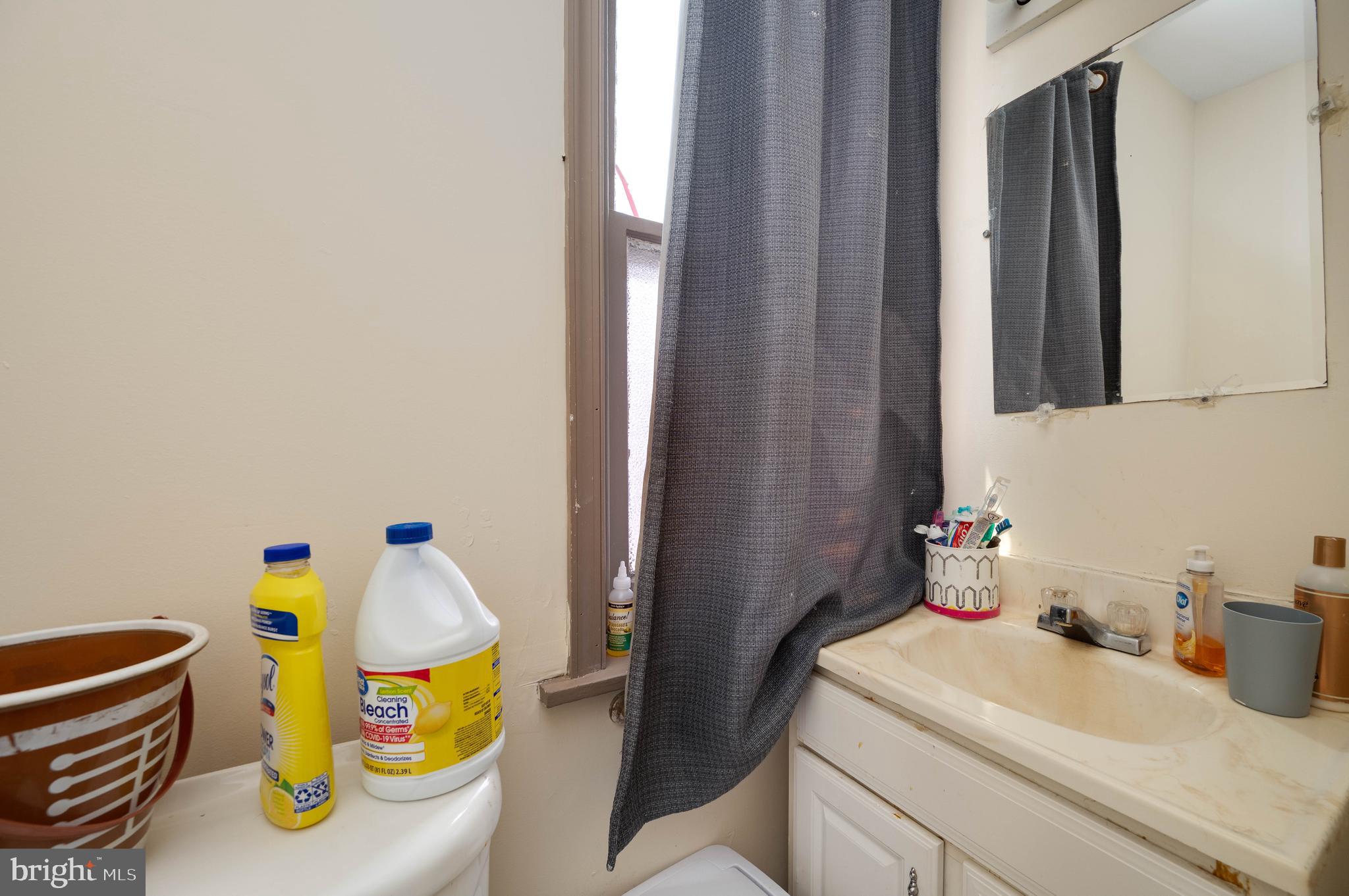 1032 North 5th Street Reading, PA 19601 - Photo 41 of 45 a bathroom with a sink and a mirror