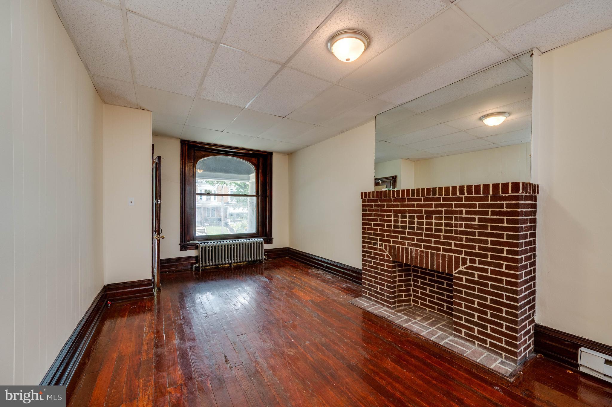 1032 North 5th Street Reading, PA 19601 - Photo 5 of 45 a view of empty room with wooden floor and fan