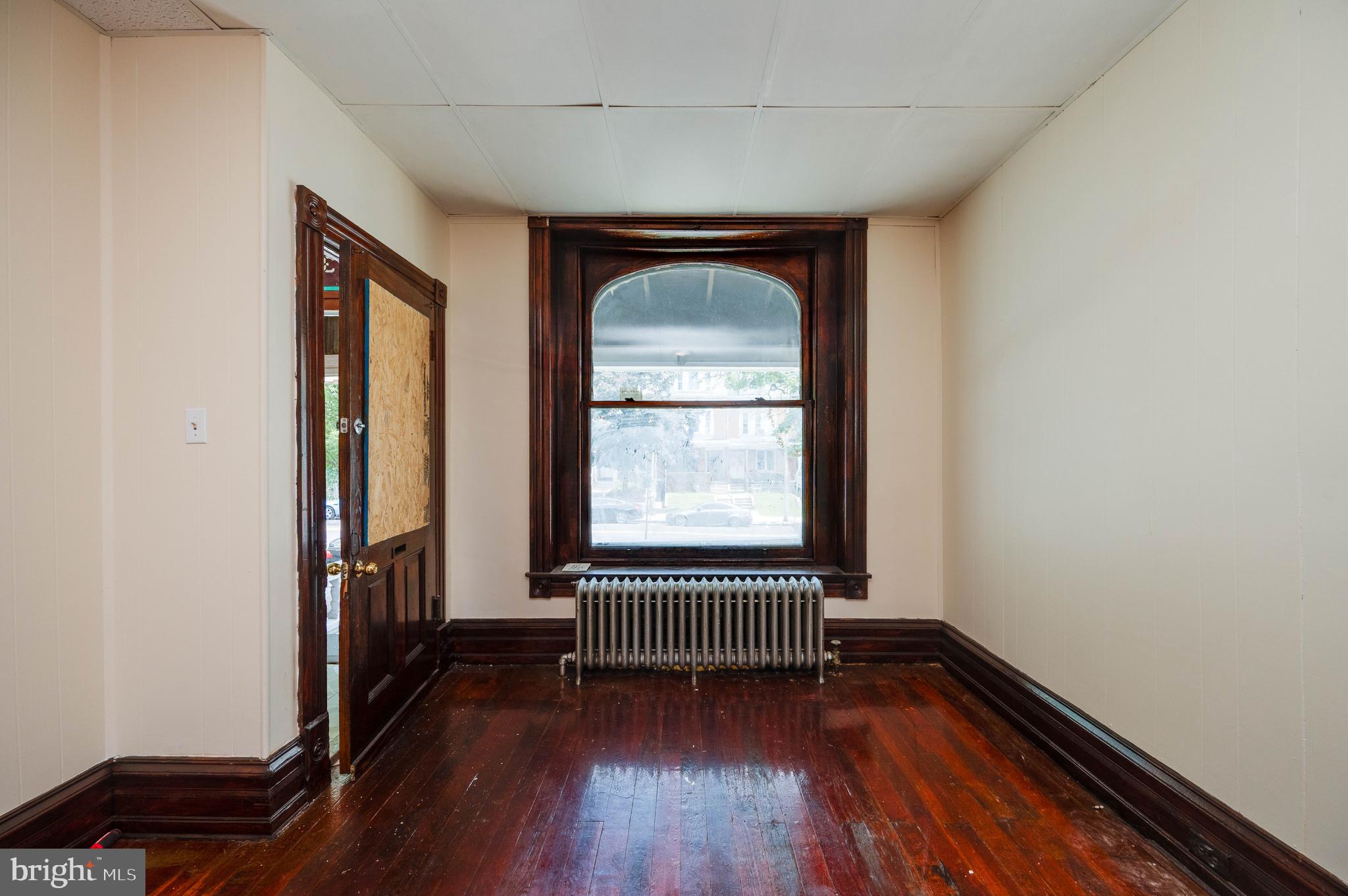 1032 North 5th Street Reading, PA 19601 - Photo 8 of 45 a view of empty room with wooden floor and fan