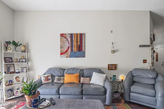 a bathroom with a granite countertop toilet sink and mirror