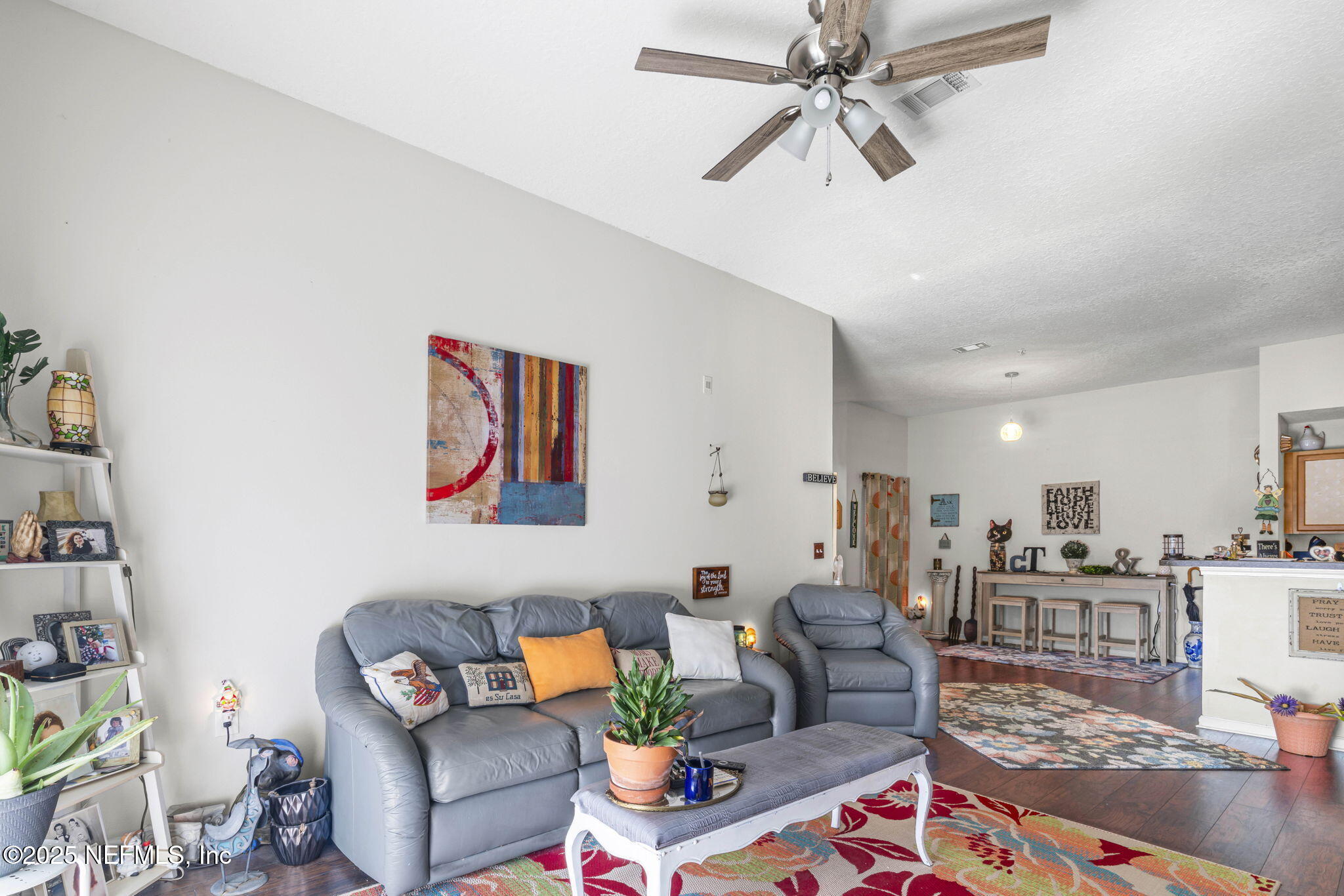 7920 Merrill Road, Unit 1206 Jacksonville, FL 32277 - Photo 15 of 35 a living room with furniture and kitchen view