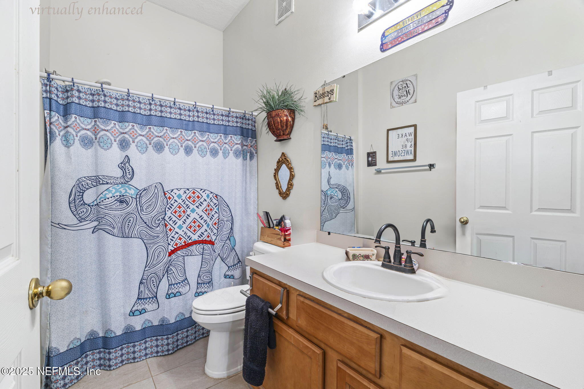 7920 Merrill Road, Unit 1206 Jacksonville, FL 32277 - Photo 16 of 35 a bathroom with a granite countertop toilet sink and mirror