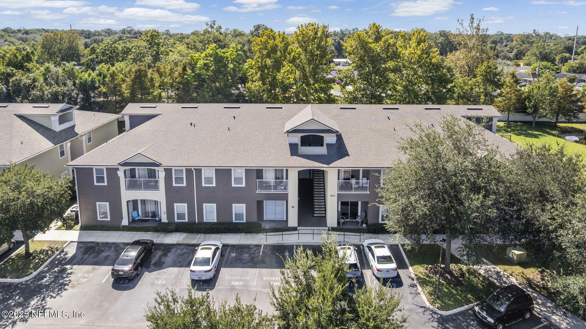 7920 Merrill Road, Unit 1206 Jacksonville, FL 32277 - Photo 2 of 35 front view of a house with a yard