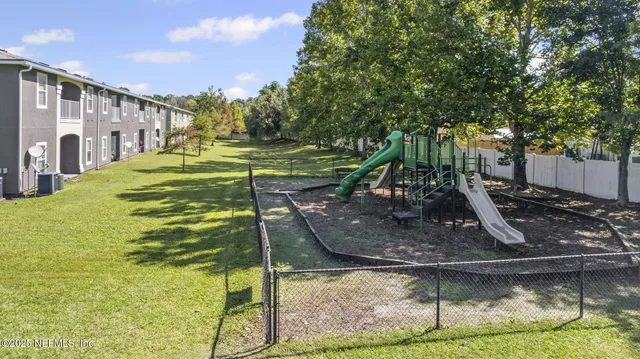 a swimming pool with outdoor seating and yard