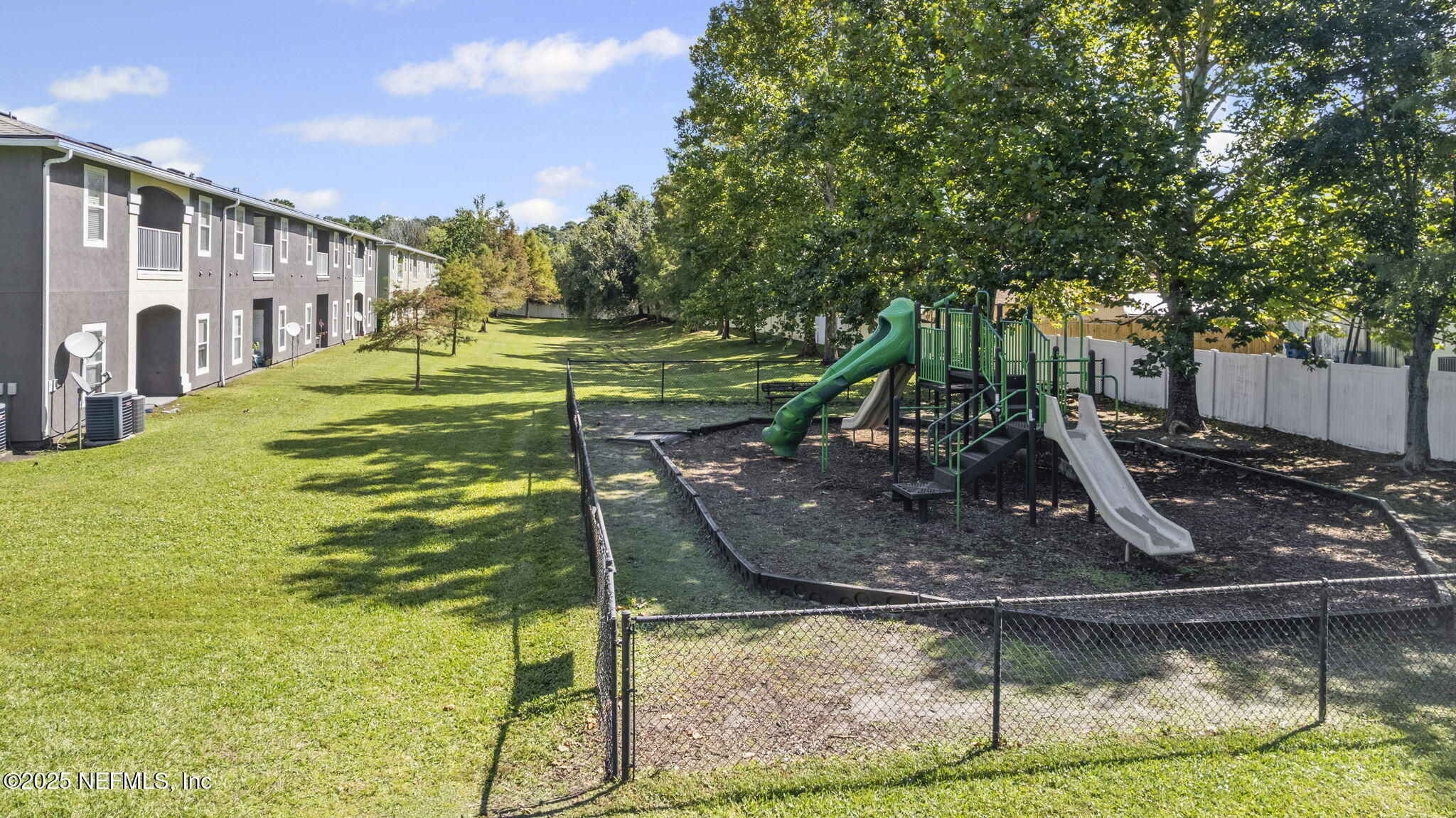 7920 Merrill Road, Unit 1206 Jacksonville, FL 32277 - Photo 22 of 35 a view of a swimming pool with a sitting area