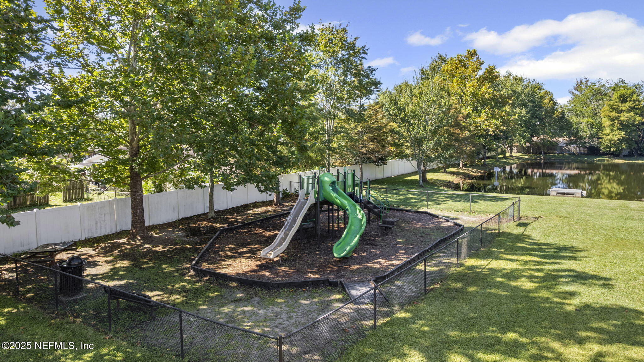 7920 Merrill Road, Unit 1206 Jacksonville, FL 32277 - Photo 23 of 35 a view of a yard with chairs